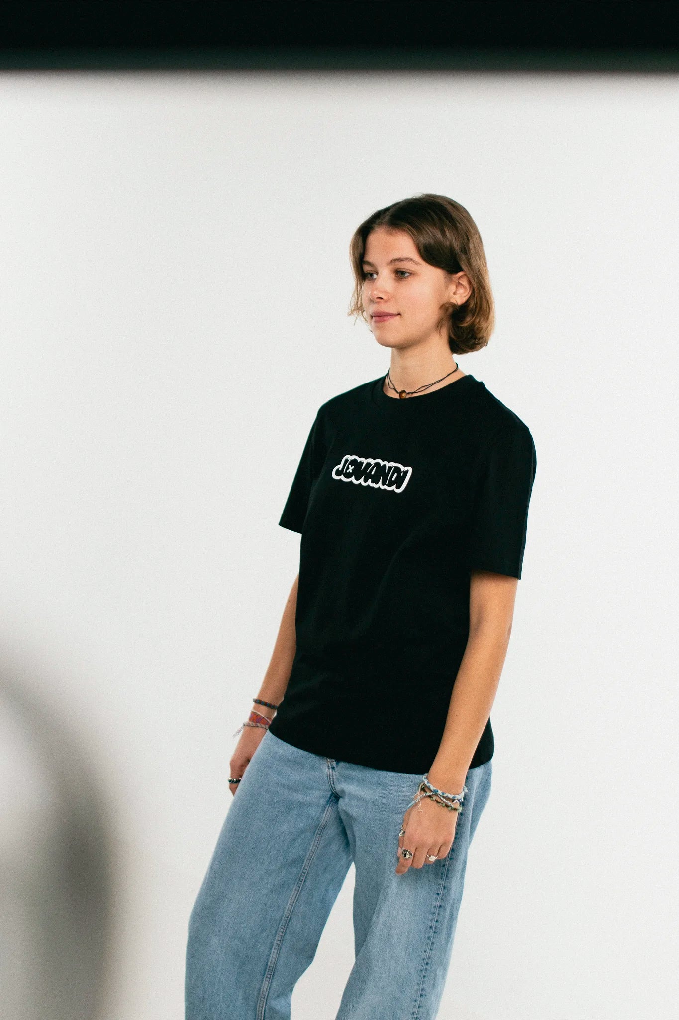 Woman wearing the black Jovandi bubble T-Shirt