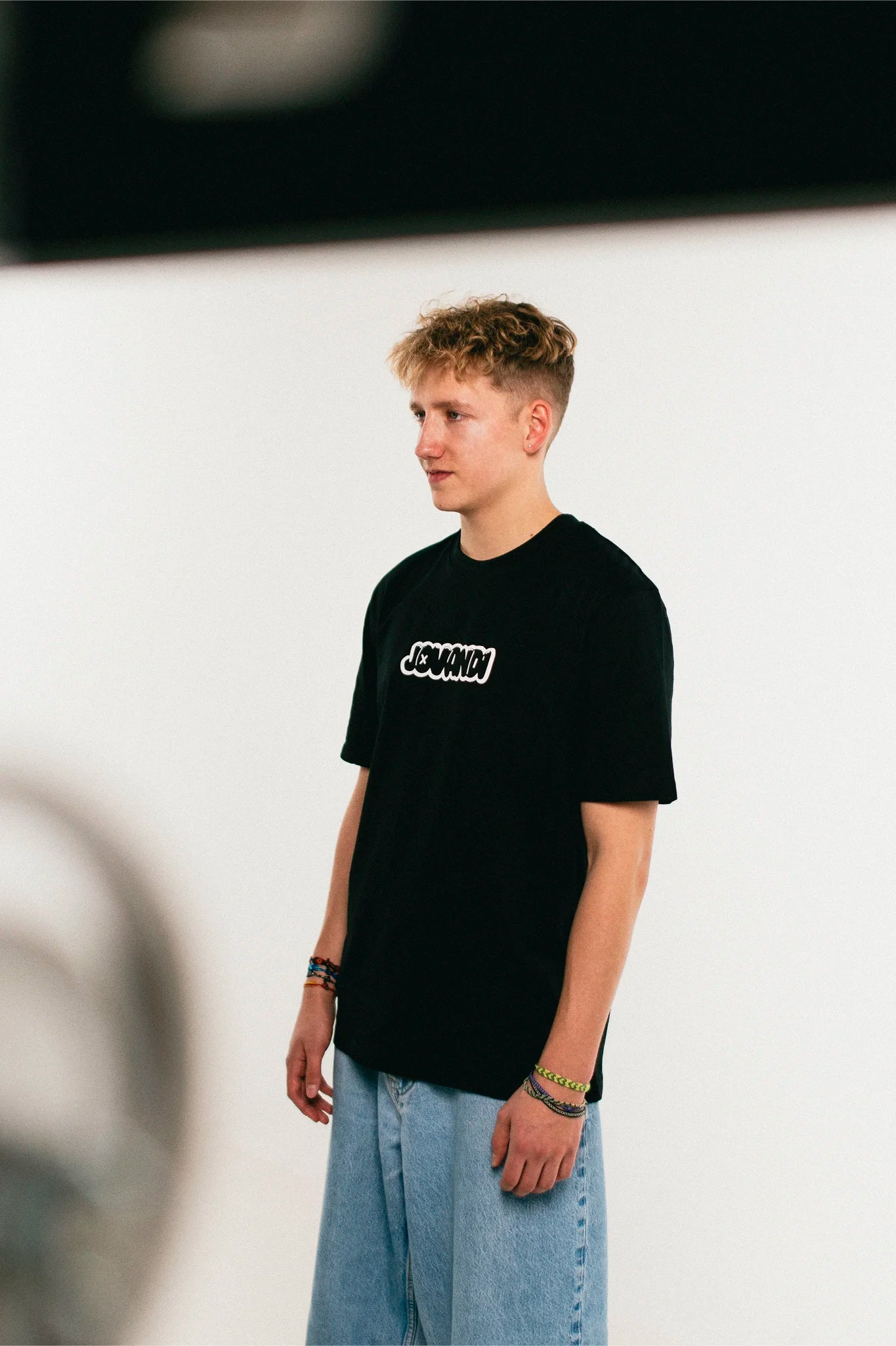 man wearing the black Jovandi bubble T-Shirt