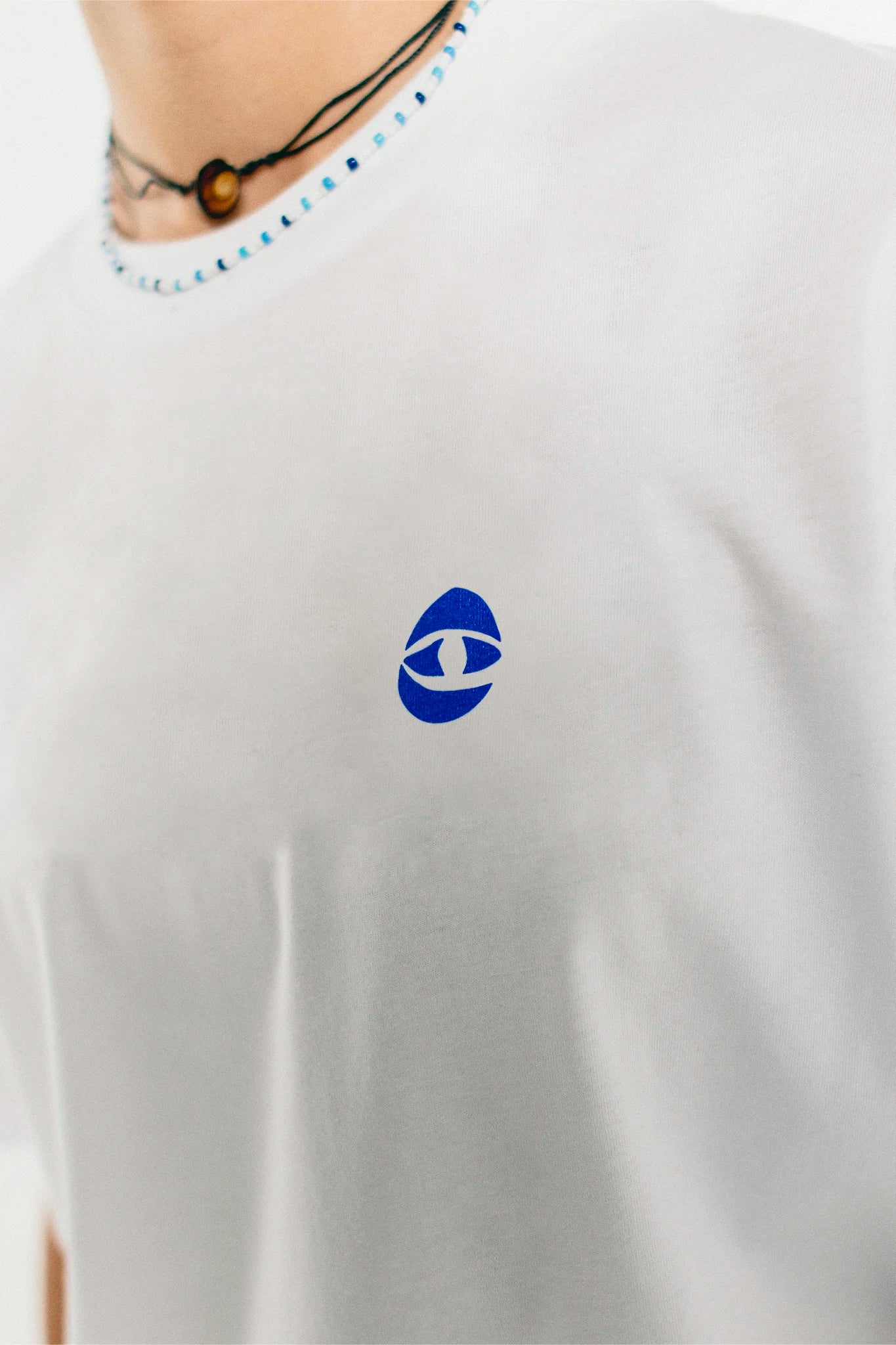 Closeup of the white and blue Jovandi Cheyes1 T-Shirt