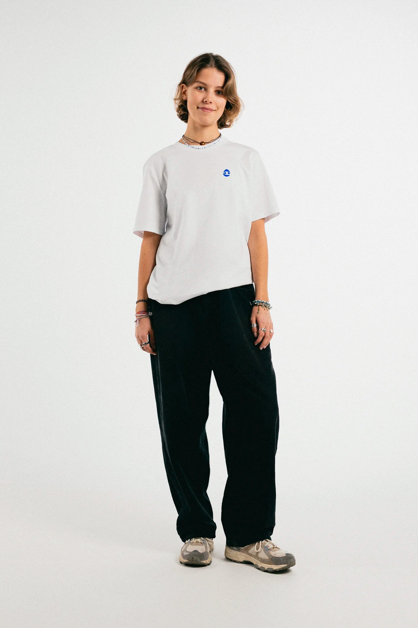 Woman wearing the white and blue Jovandi Cheyes1 T-Shirt