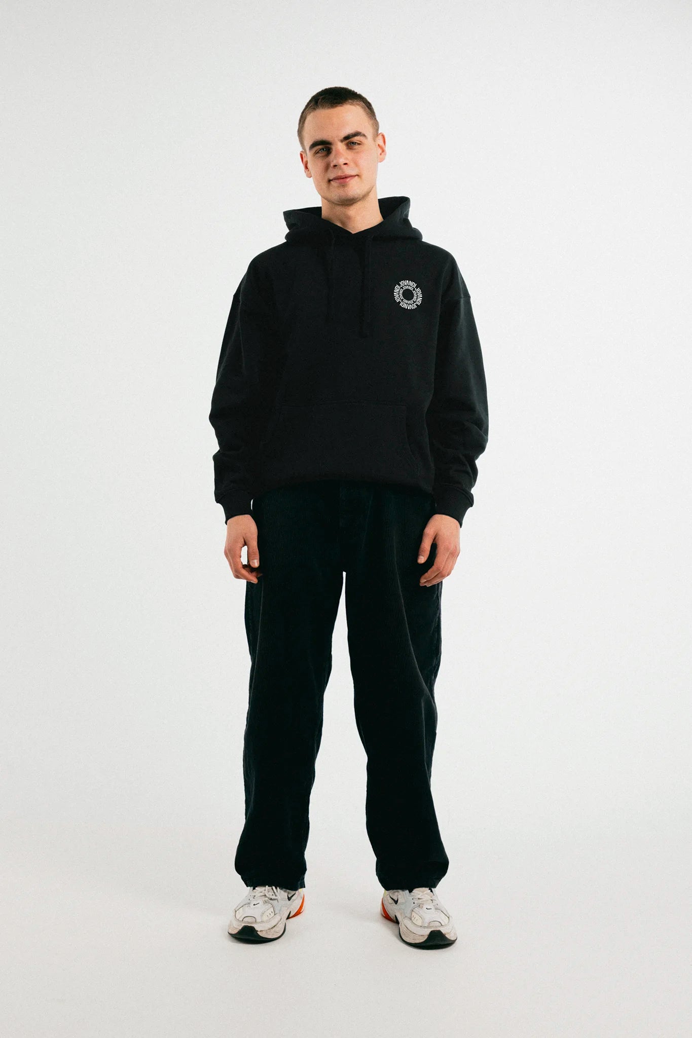 Man wearing the black Jovandi circle hoodie
