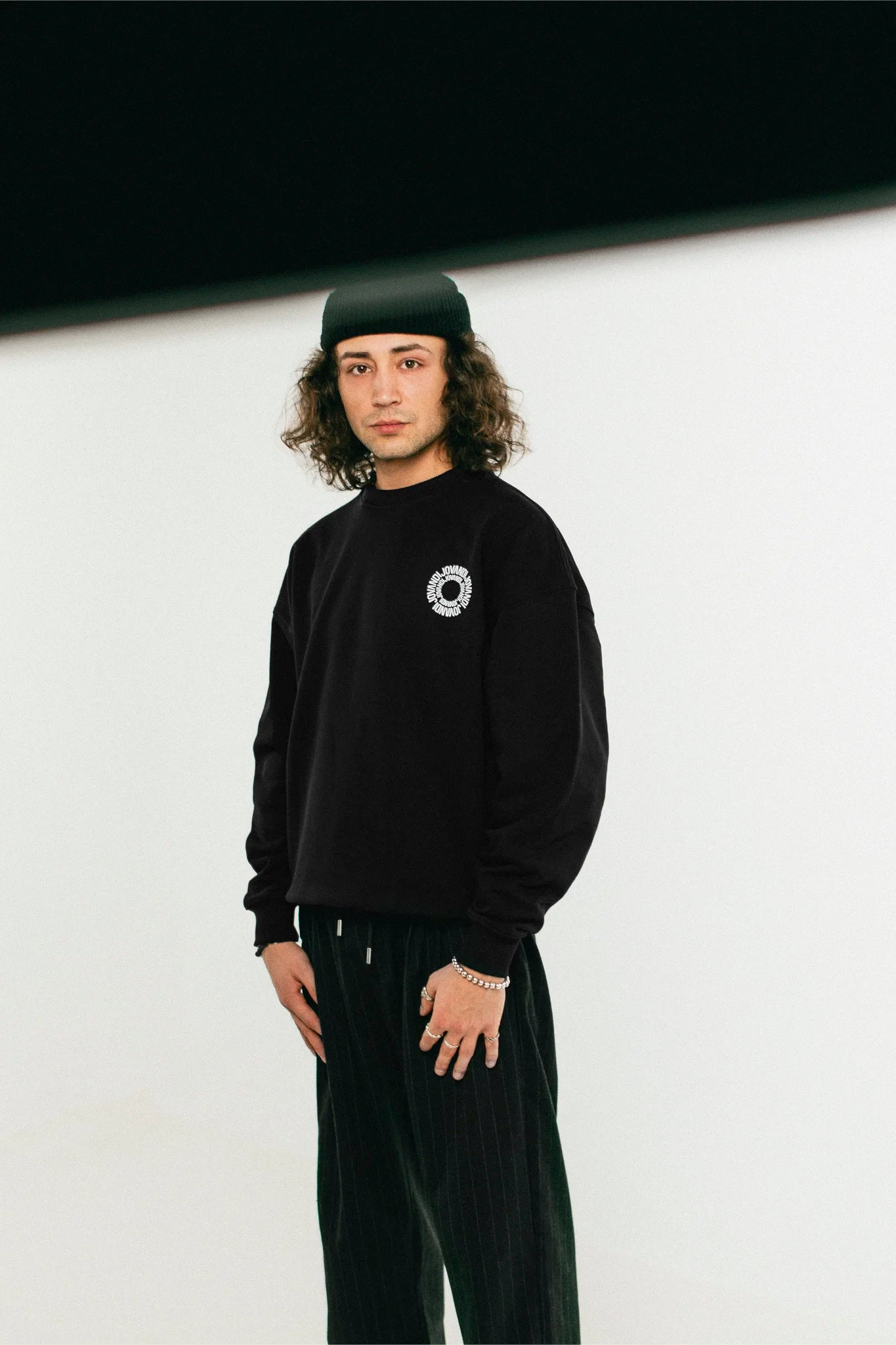 Perspective of the black Jovandi Circle sweater