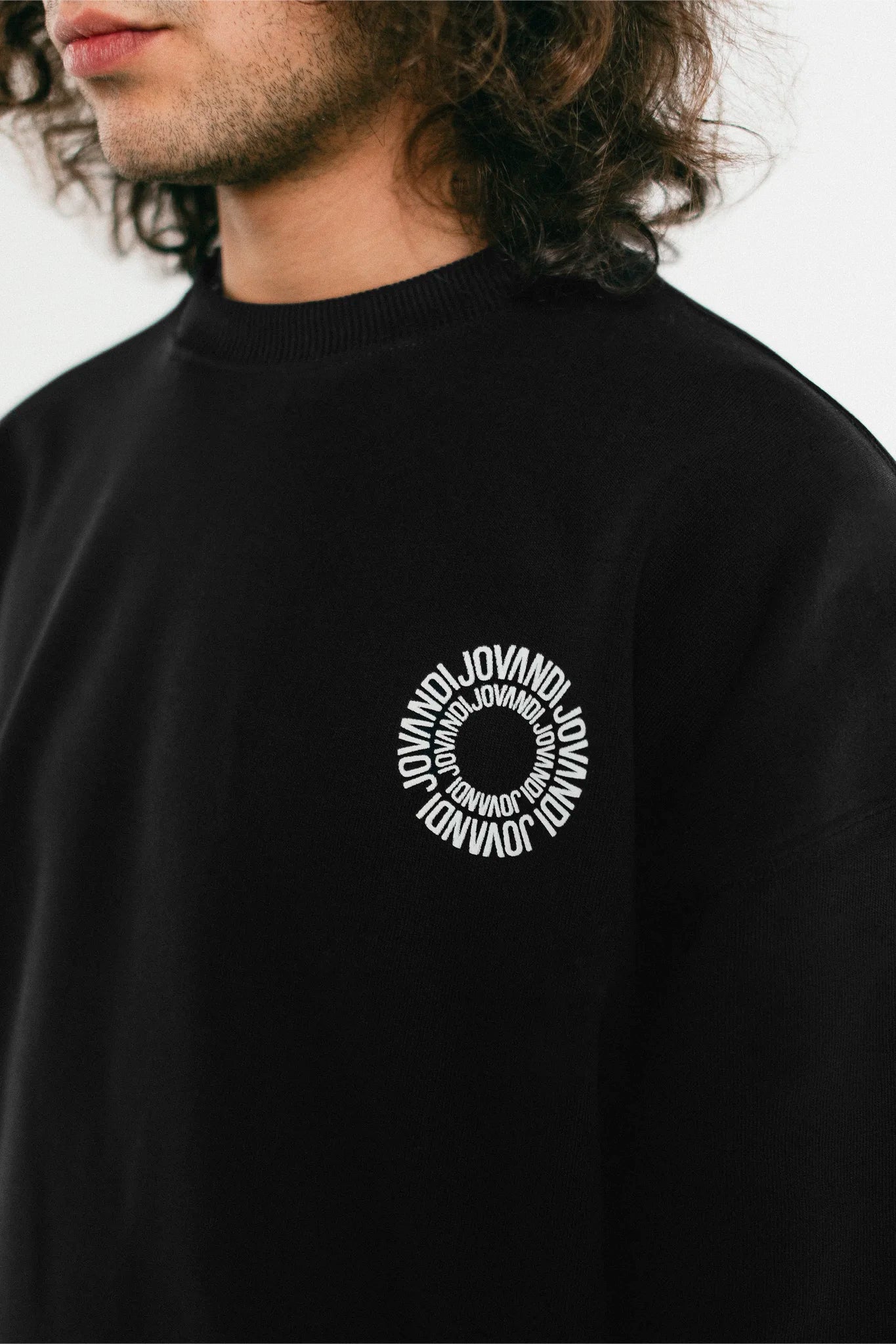 Closeup of the black Jovandi Circle sweater