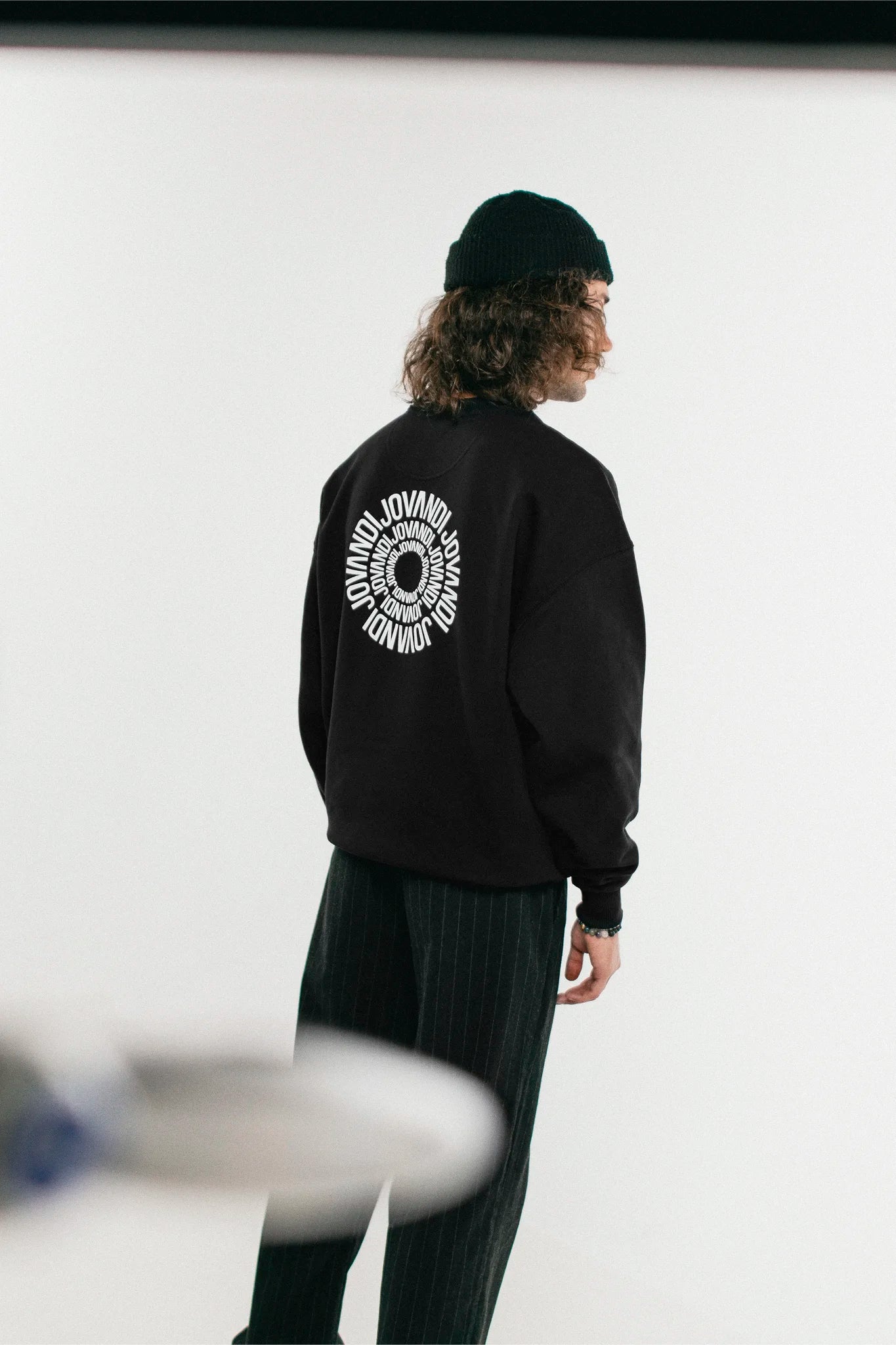 Perspective of a man with the black Jovandi Circle sweater