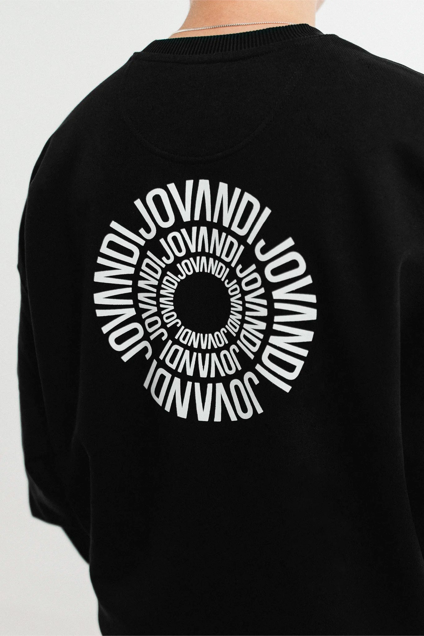 Closeup of the black Jovandi Circle sweater