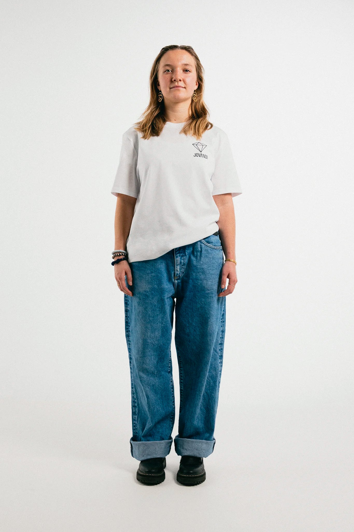 Woman wearing the white Jovandi Diamonds T-Shirt in front of a white background