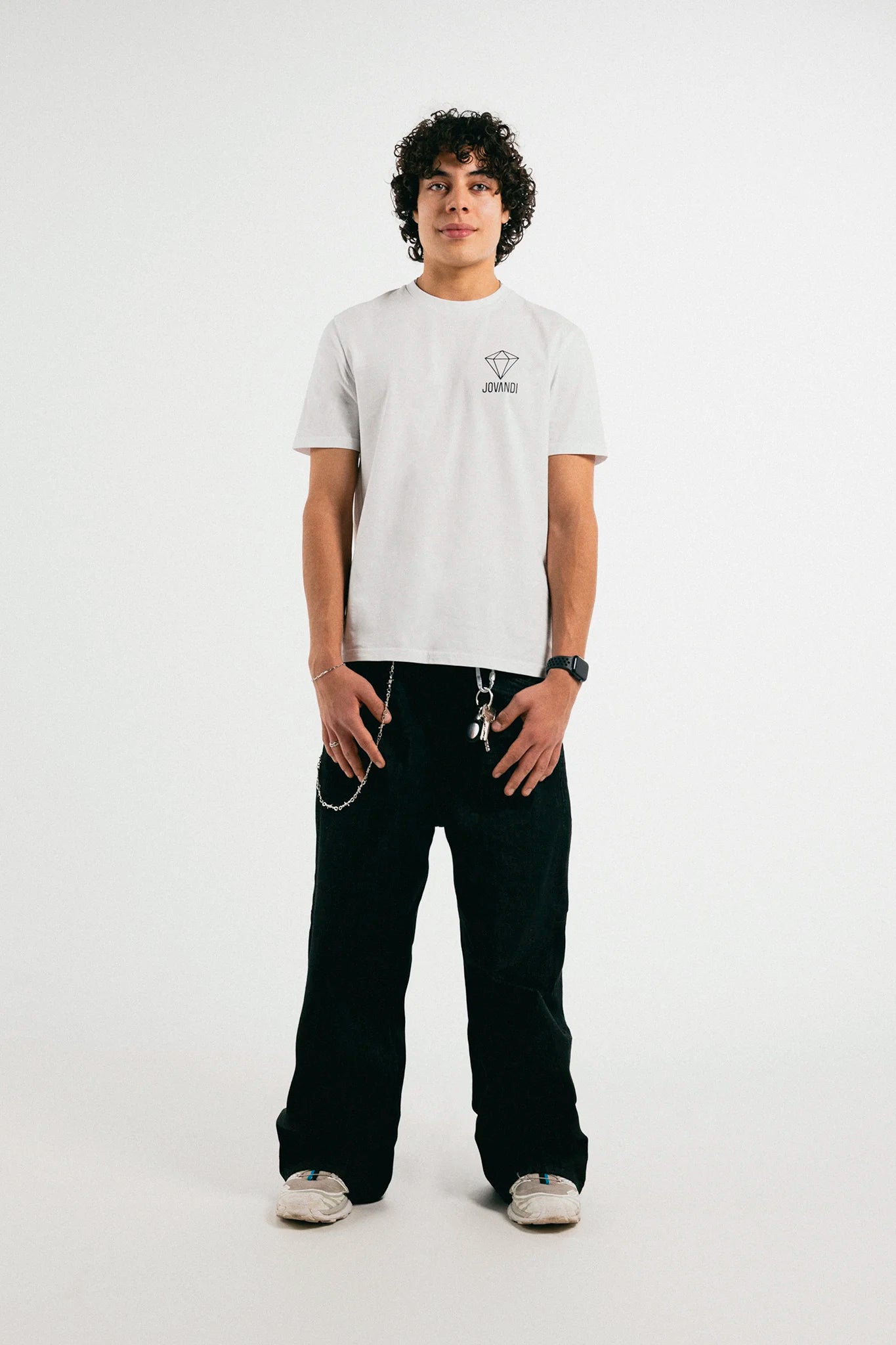 Man wearing the white Jovandi Diamonds T-Shirt in front of a white backdrop