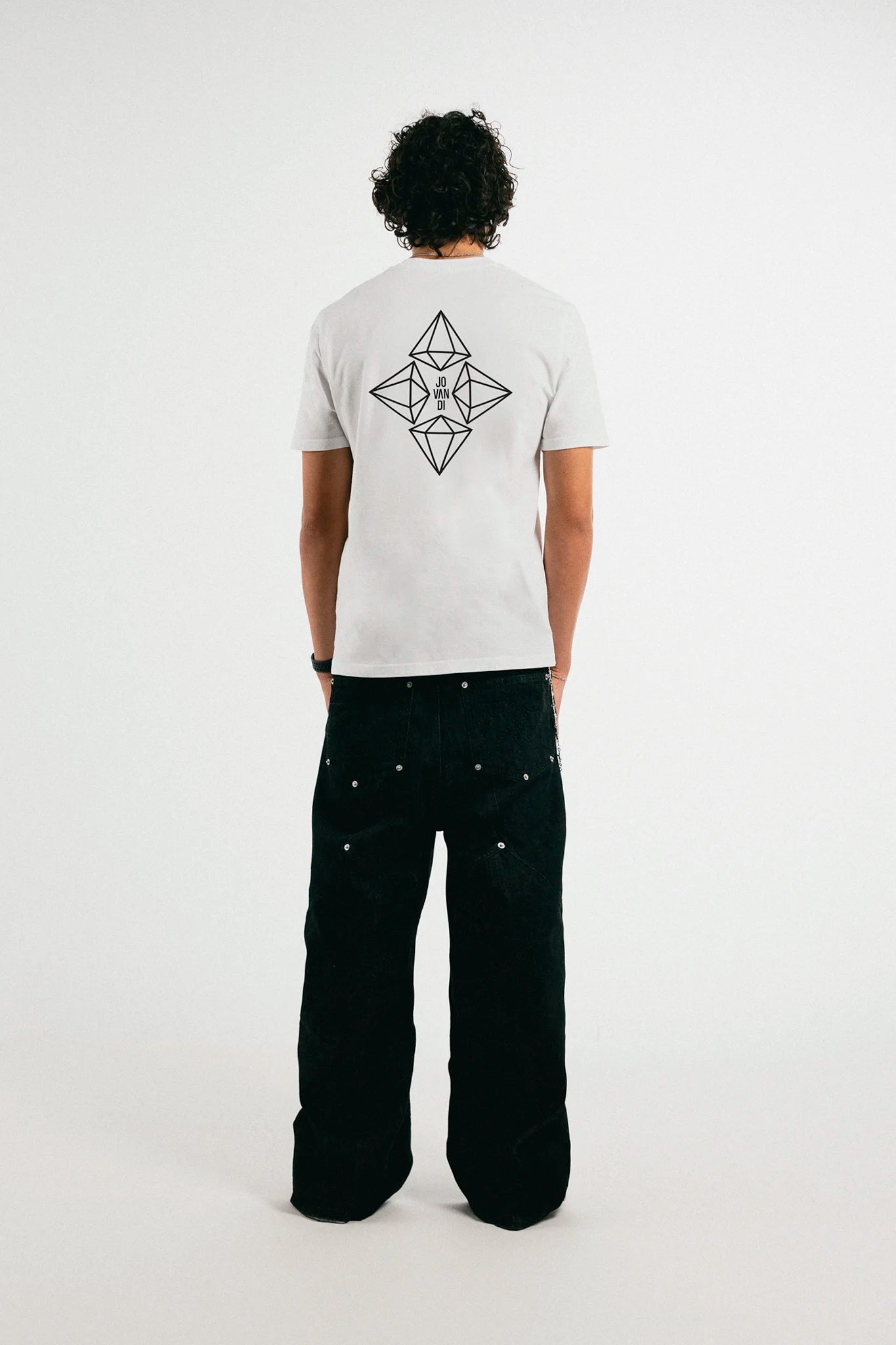 Man wearing the white Jovandi Diamonds T-Shirt in front of a white background