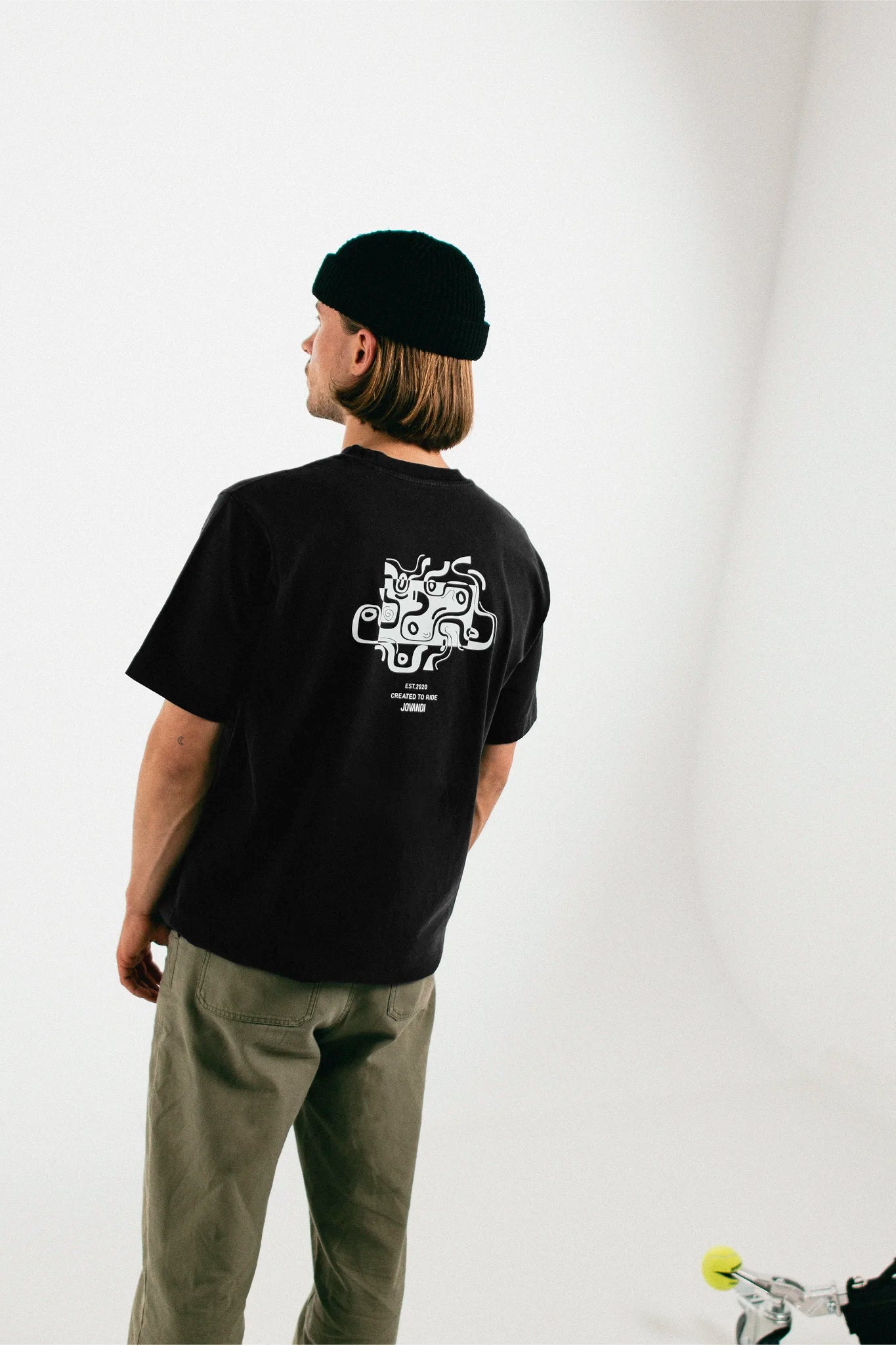 Man wearing the black Jovandi Drawn Lines T-Shirt