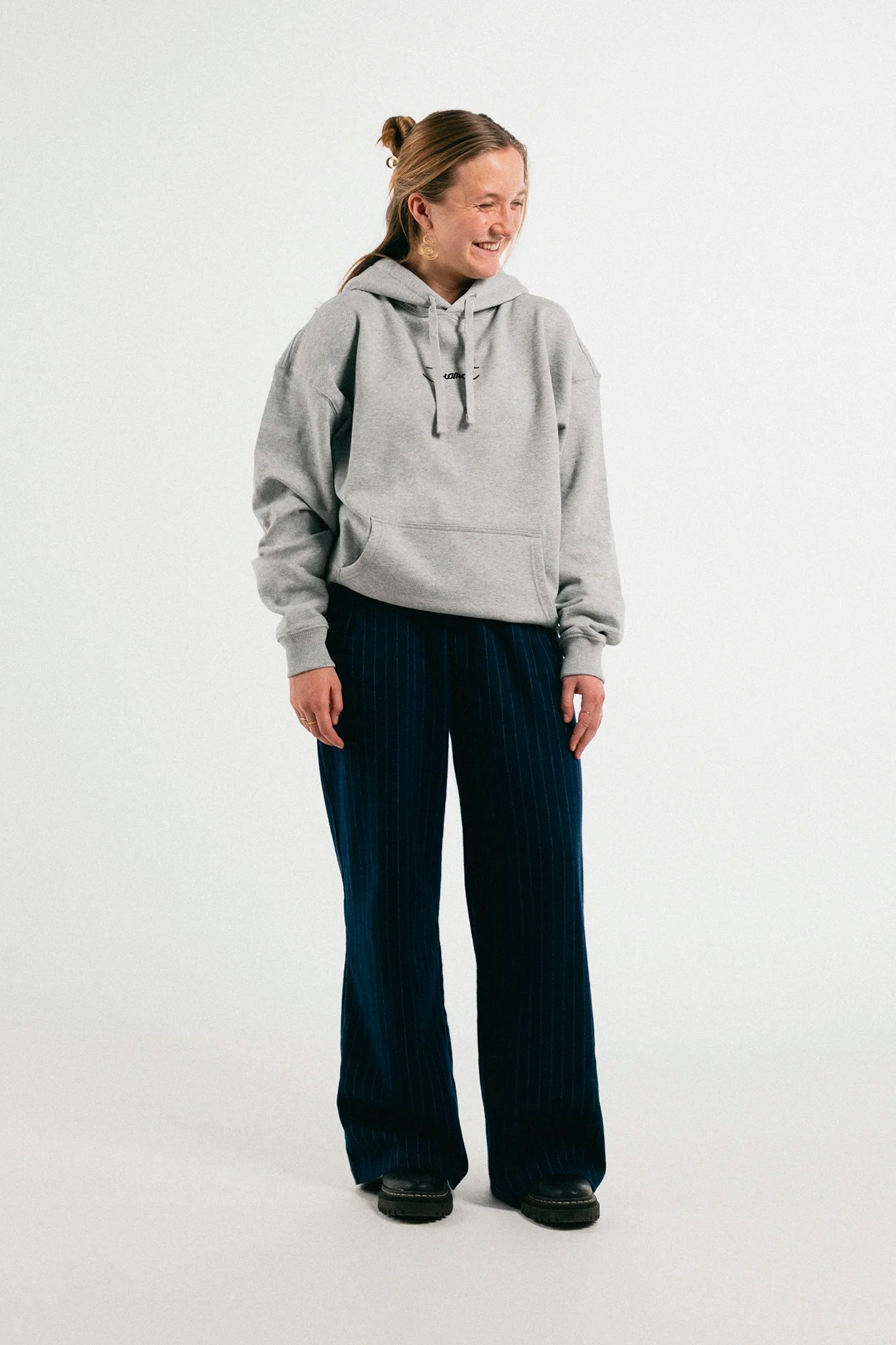 Woman wearing the heather grey Jovandi guitar hoodie