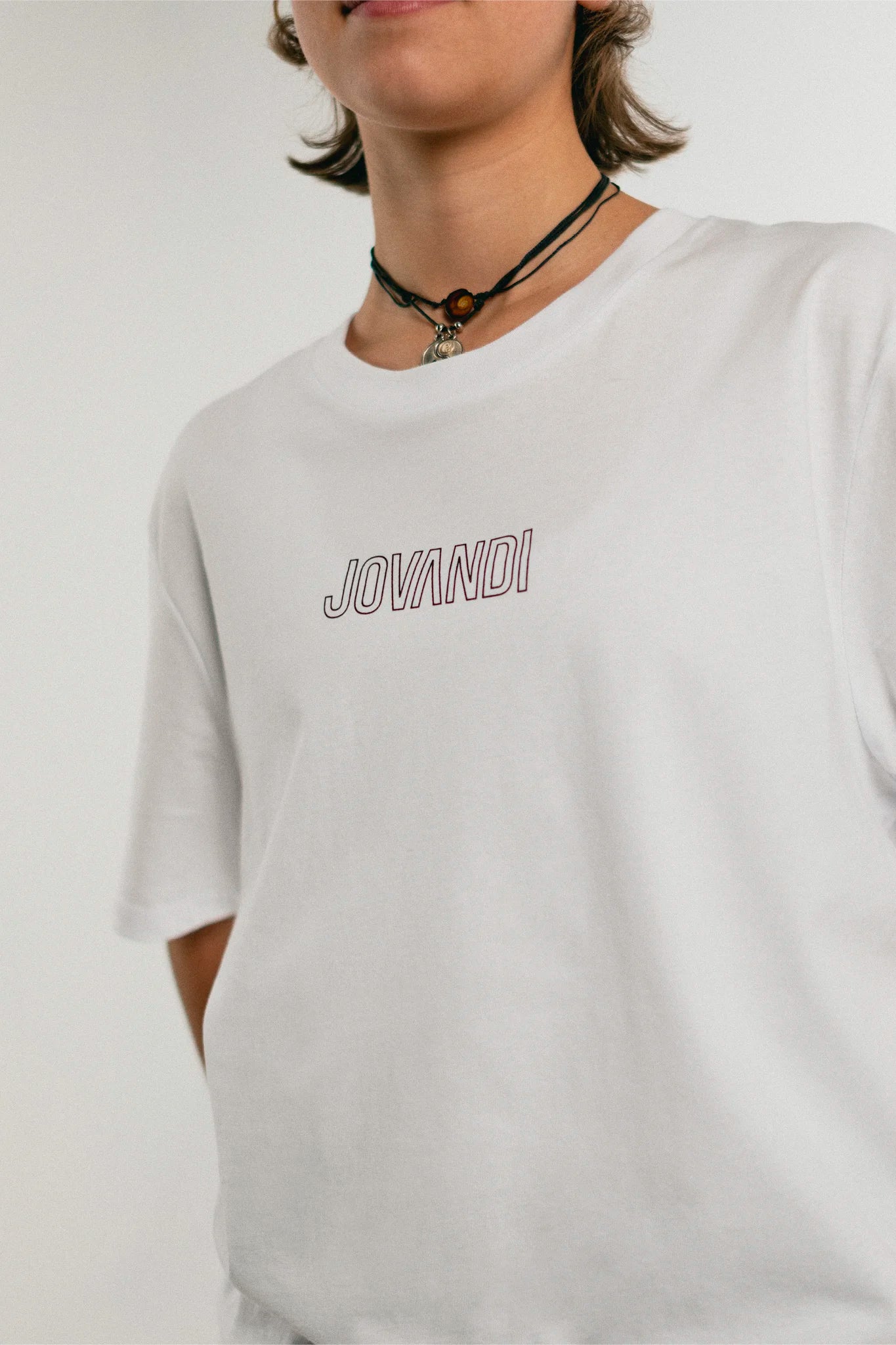 Woman wearing the white Jovandi Lines T-Shirt