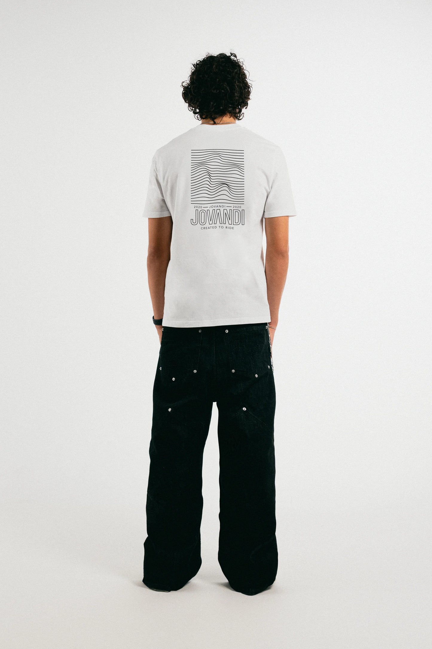 Man wearing the white Jovandi lines T-Shirt