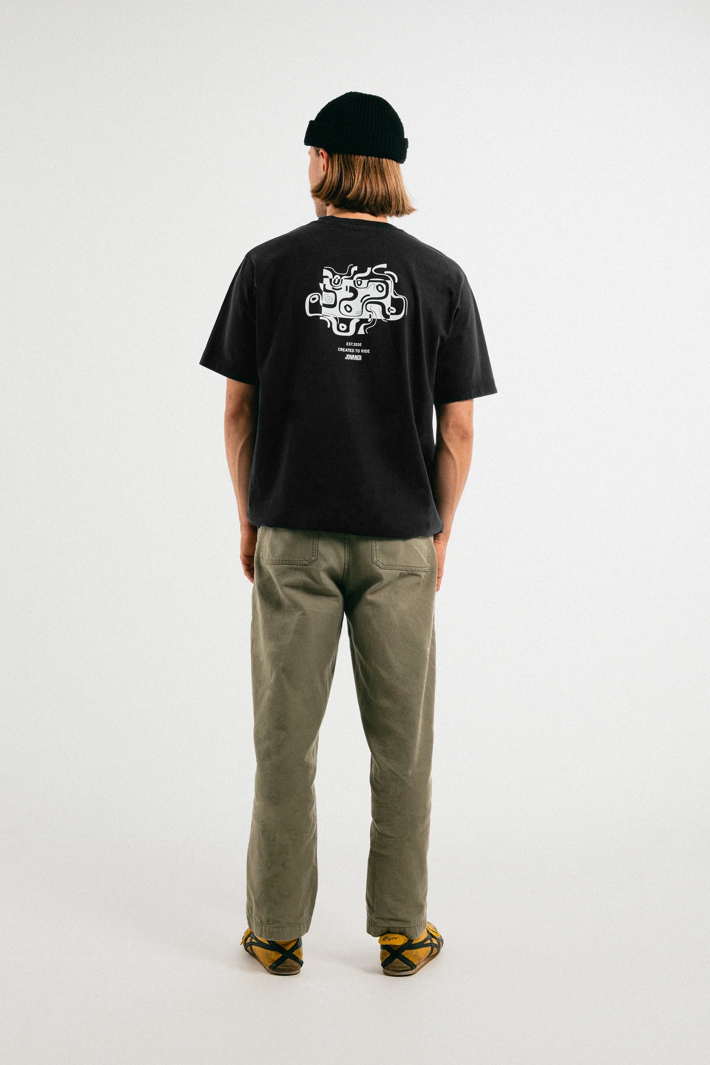 Man wearing the washed out black Jovandi drawn lines T-Shirt