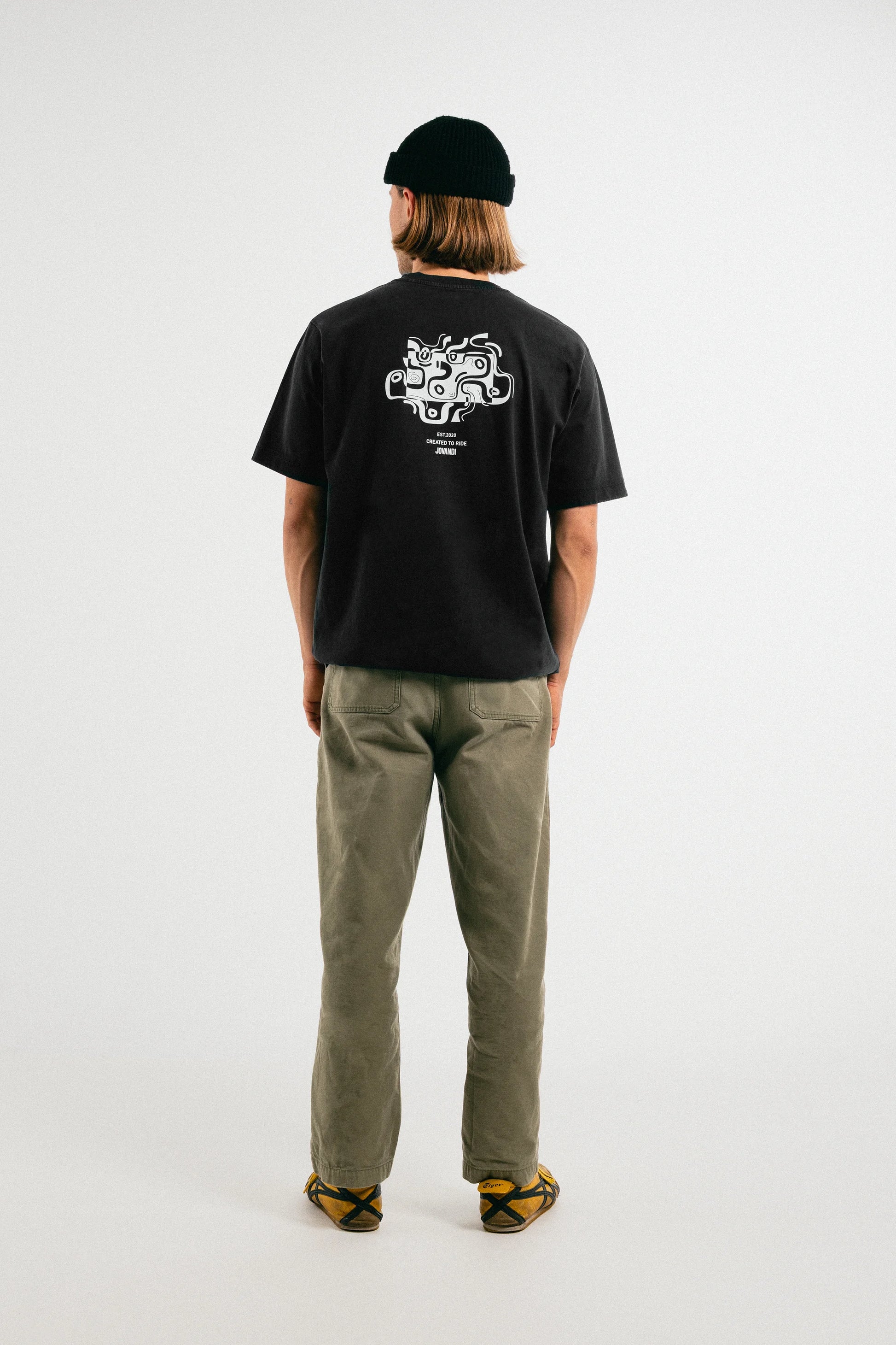 Man wearing the washed out black Jovandi drawn lines T-Shirt